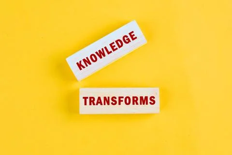 KNOWLEDGE TRANSFORMS concept words assembled from blocks on yellow background Stock Photos