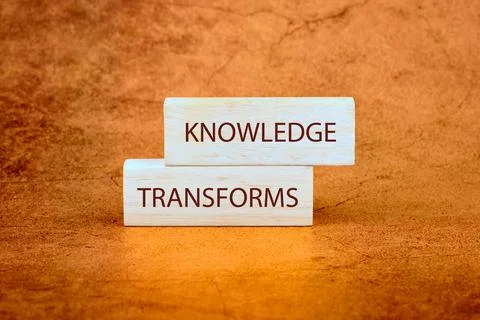 KNOWLEDGE TRANSFORMS concept words on wooden blocks on a bright background Stock Photos