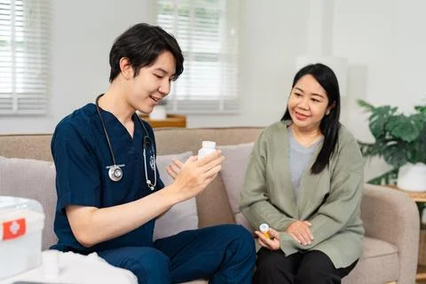 Knowledgeable healthcare provider explaining medication details to patient Stock Photos