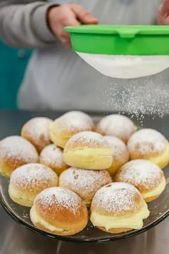 Known in Brazil as a dream, it is a kind of sweet bread filled Stock Photos