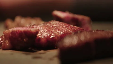 Kobe beef being preparred on a teppan griddle in a restaurant in Japan Video stock 130351831