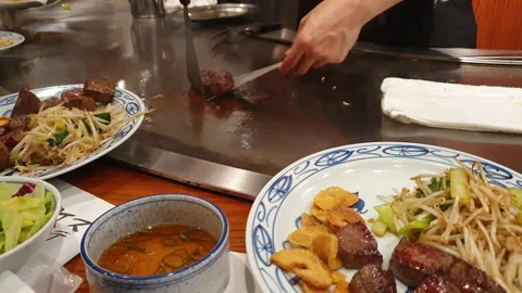 Kobe beef steak juicy meat serve marble beef tepanyaki cooking Japanese style Stock Footage 242570972
