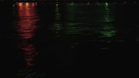 Kobe, Japan - Circa 2019: Reflections and pan up of Kobe Port Tower and Maritime Video stock 130335057