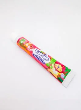 Kodomo kids toothpaste with strawberry flavour on white background Stock Photos
