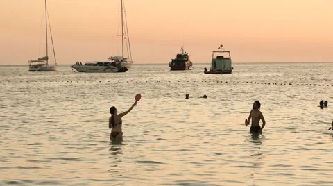 KOH LIPE, CIRCA 2015: Young people playing beach tennis in the water Stock Footage 63179231