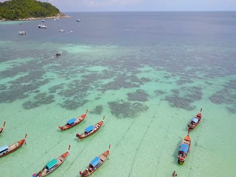 Koh LIPE Island. Aerial view a paradise with group of long tail boat Stock Footage