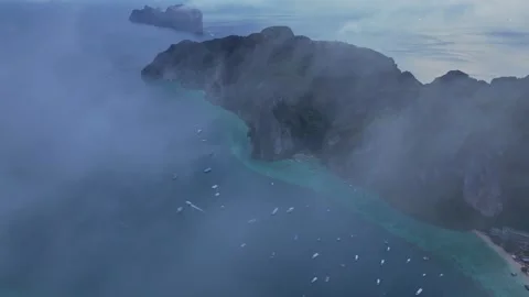 Koh Phi Phi glows under early misty sky at blue hour, Thailand Stock Footage 307439338