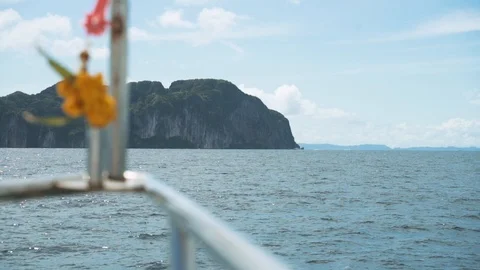Koh Phi Phi in Thailand viewed from a boat that approaches the island Stock Footage 125387945