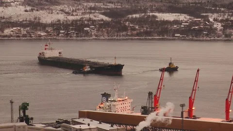 Kola Bay - tugs deploy the largest ship in the winter. Stock Footage 71346328