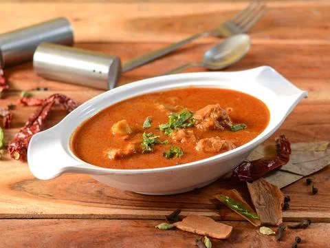 Kolhapuri Mutton masala or Kolhapuri Mutton tambda rassa or red meat curry is Stock Photos