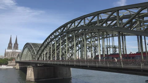 Koln cathedral train pass Hohenzollern bridge Rhine river German landmark day  Video stock 40544089