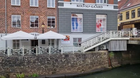 Kolvig's Gaard Building and Ribe River Canal Bridge, Ribe, Denmark, Summer Stock Footage 333896746