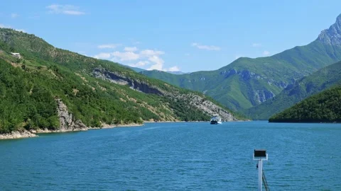 Komani Lake ferry cruise boat view near the town of Fierz, Albania Stock Footage