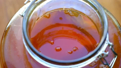 Kombucha process - SCOBY inserted into sweet tea for fermentation Stock Footage 167257325
