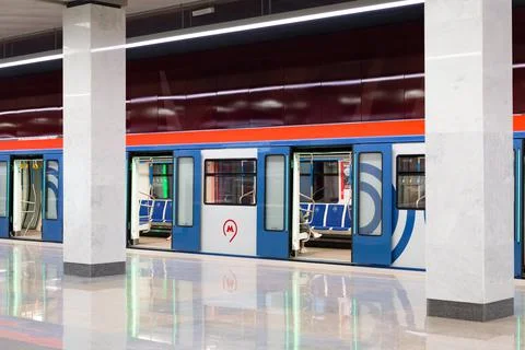 Kommunarka platform with a train standing at the platform Stock Photos