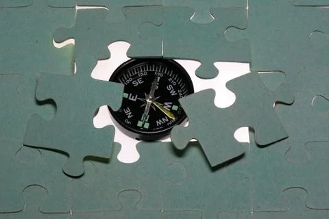 Kompass im Puzzle Stock Photos