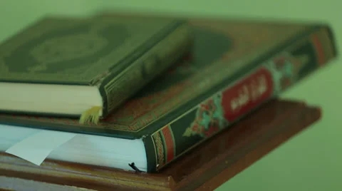 Koran on the table 01 Stock Footage 36537093