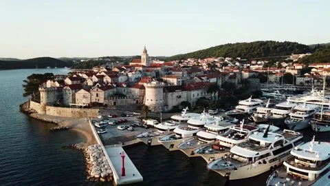 Korcula. A drone flyby a curch over Croatian village at Dalmatian coast. 4K Stock Footage 246921686