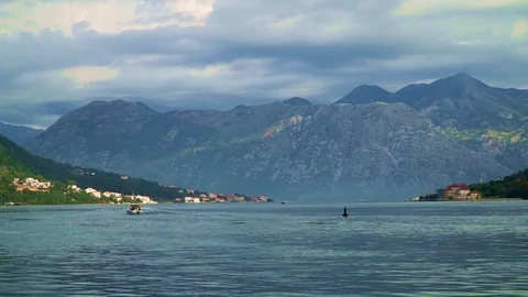 Korcula harbour with mountains and a dramatic sky in the background Stock Footage 124129091