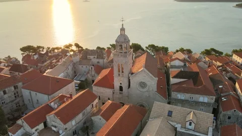 Korčula Sunrise Old Town Cathedral Zoom Out Orbital 4K HDR Stock Footage