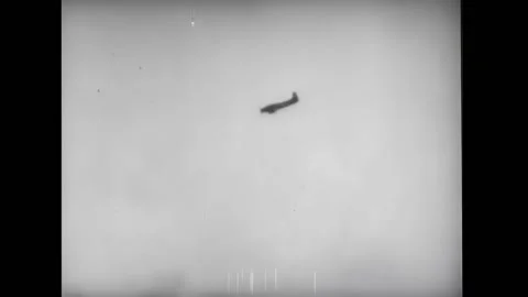 KOREA - 1951 - Napalm explodes on enemy positions in the snow-covered mountain Stock Footage 316680465