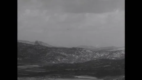 KOREA - 1952 - Bomber planes dropping bombs over enemy positions. Bombs explode Stock Footage 312791163