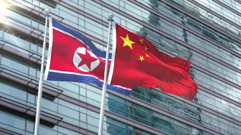 Korea North Flag VS Flag of China Stock Footage 343578213