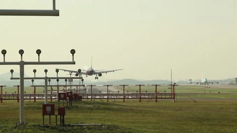 Korean Air passenger plane passing after landing of Asiana Airlines passenge Stock Footage 144677785