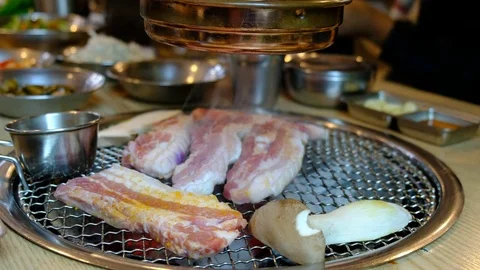 Korean barbecue stoves with chacoal inside ready for yakiniku. (Jeju pork belly) Stock Footage 80862593