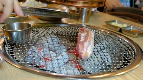 Korean barbecue stoves with chacoal inside ready for yakiniku. (Jeju pork belly) Stock Footage 80862631