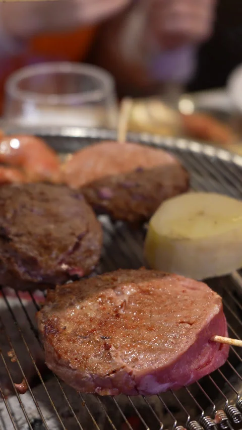 Korean BBQ Beef Slices Grilling on Tabletop Stock Footage 342616131