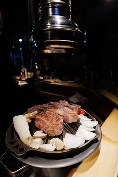 Korean BBQ Beef on Table Grill with Mushrooms and Vegetables Stock Photos