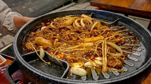 Korean BBQ Grill with Beef Enoki Mushrooms and Onions Stock Photos