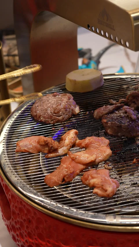 Korean BBQ Meat Cooking on Tabletop Grill Stock Footage 342616103