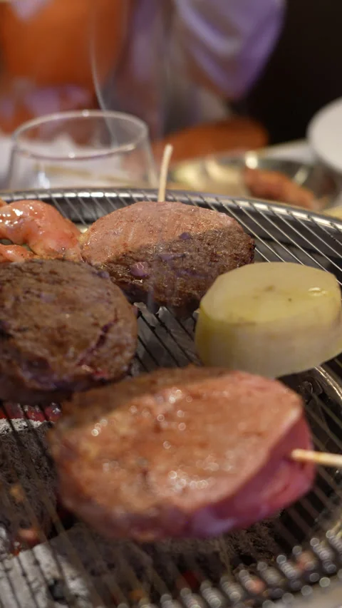 Korean BBQ Meat Grilling on Tabletop Grill Stock Footage 342616484