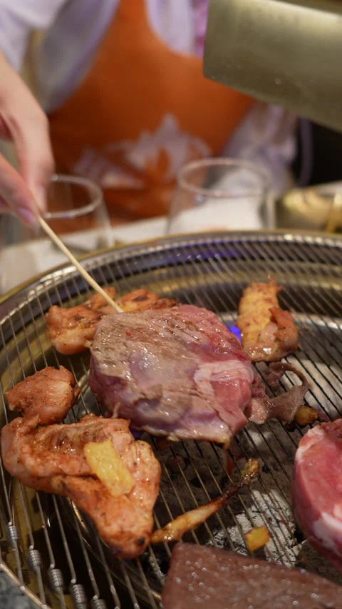 Korean BBQ Meat Grilling on Tabletop Grill Stock Footage 342616581