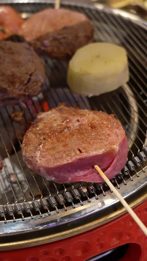 Korean BBQ Meat Grilling on Tabletop Grill Stock Footage 342616656