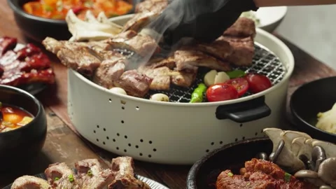 Korean BBQ Short Ribs Being Cut with Kitchen Scissors Stock Footage 335733030