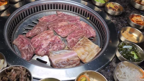 Korean BBQ With Various Side Dishes Video stock 232910482