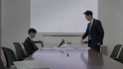 Korean Businessman Standing at Head of Empty Conference Table 스톡 동영상 338043149