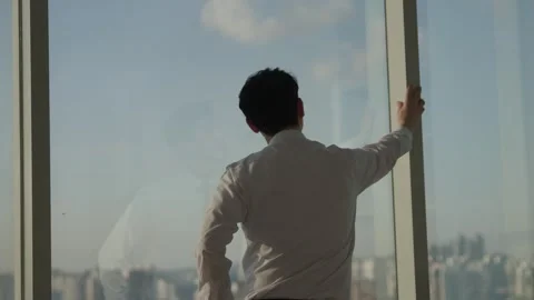 Korean Businessman Touching Office Window with City View Stock-Footage 338060201