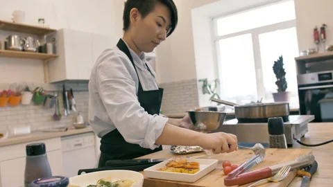 Korean chef mixes in a bowl of mashed potatoes Stock Footage 125922264