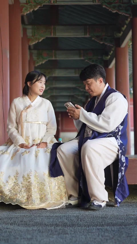 A Korean couple, a man in his 30s and a woman in her 20s, wearing hanbok from Stock Footage 293062004