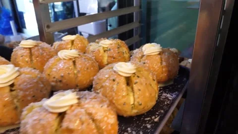 Korean Cream Cheese Garlic Bread Freshly Baked in Local Bakery Display Case Video stock 343587499