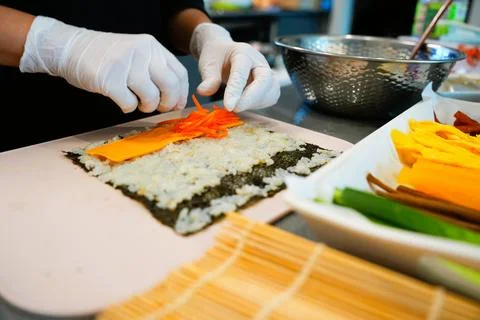 Korean Kimbap: The Culinary Process of Rolling and Slicing Gimbap Stock Photos