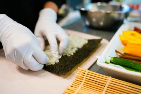 Korean Kimbap: The Culinary Process of Rolling and Slicing Gimbap Stock Photos