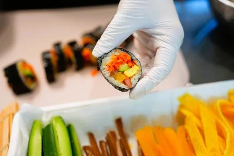 Korean Kimbap: The Culinary Process of Rolling and Slicing Gimbap Stock Photos