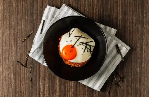 Korean Kimchi fried rice with fried egg on wooden background, Korean food, to Stock Photos