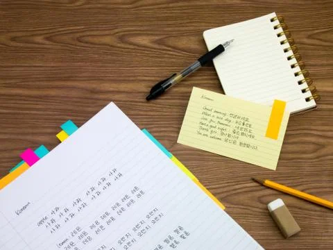 Korean; Learning New Language Writing Words on the Notebook Stock Photos