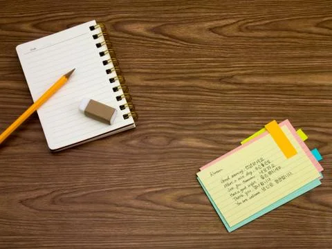 Korean; Learning New Language Writing Words on the Notebook Stock Photos